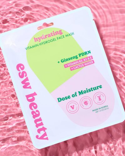 ESW Beauty Dose of Moisture Hydrating Vitamin Hydrogel Face Mask package displayed on a pink water-textured background.