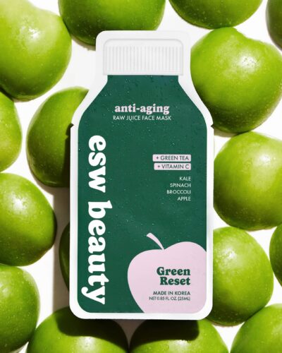 ESW Beauty Green Reset sheet mask package styled with green apples on a white background.