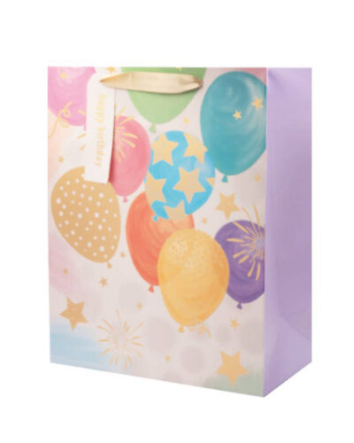 Colorful birthday gift bag with balloons, foil details and ribbon handles