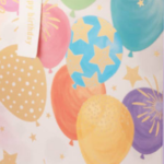 close up image of colorful balloon art on gift bag